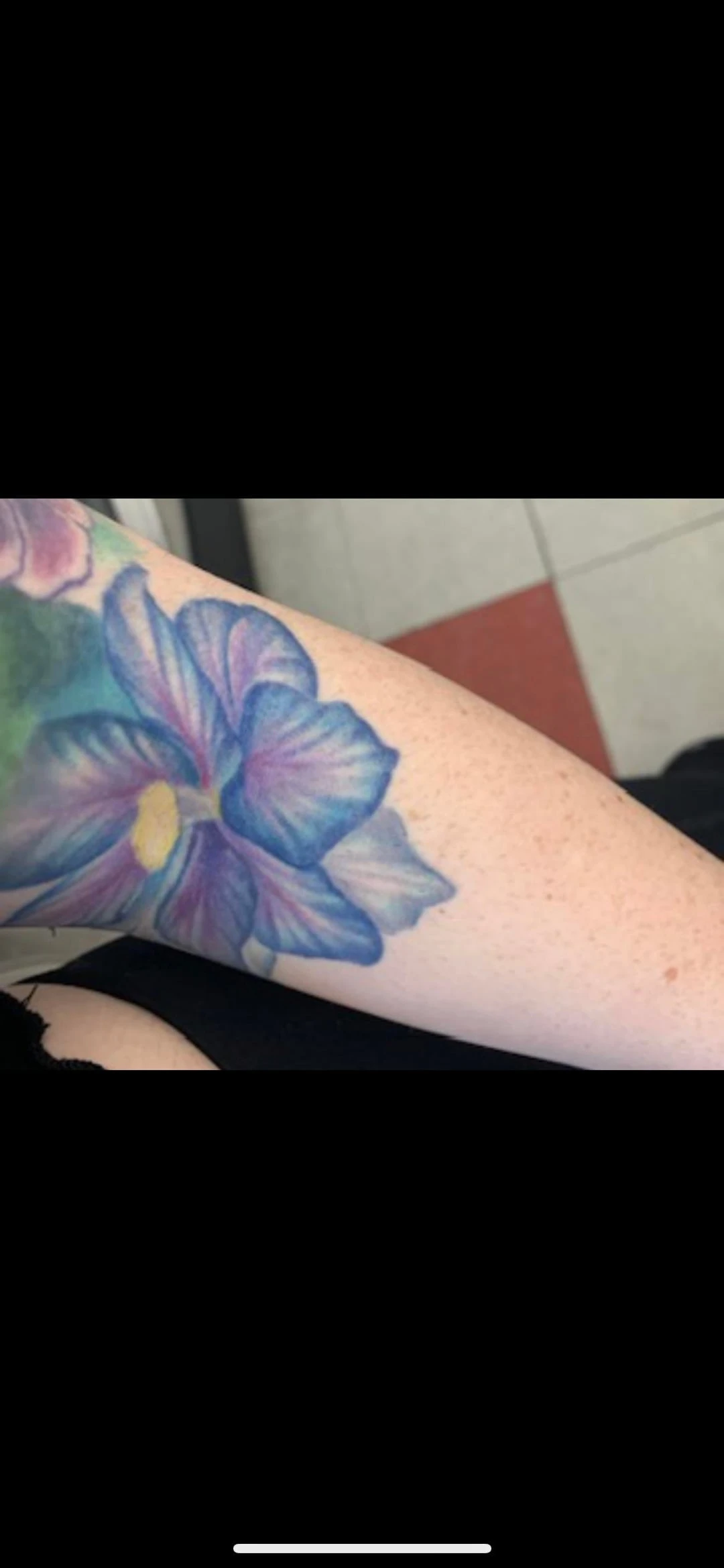 blue, purple, yellow and green tattoo after  sessions