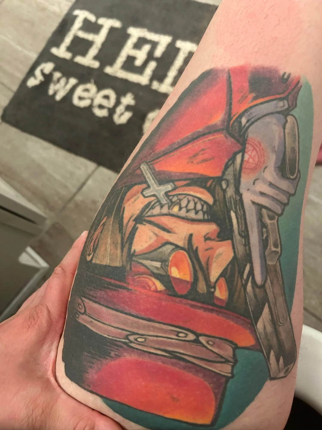 black, yellow, orange, red and green tattoo after 2 sessions
